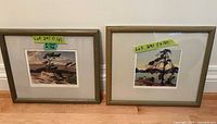 Both framed prints side by side on floor