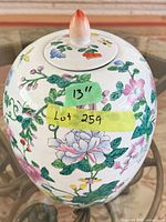 Full view of ginger jar showing lid, finial, floral painting and 13" height note