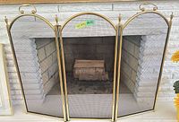 Full view of three-panel fireplace screen in front of fireplace