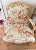 Front view of French Provincial floral upholstered armchair