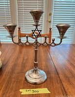Full view of menorah standing on table