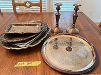 Overview of stacked trays, separate round tray and two candlestick holders