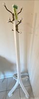 full view of white coat rack showing height and base