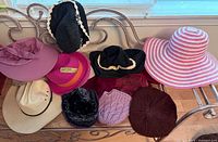 All ten hats displayed on bench