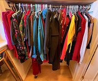 Full view of hanging garments on closet rod