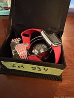 Box containing assorted wristwatches
