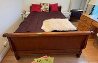 Full view of assembled wooden sleigh bed frame