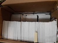 Top view of box showing large quantity of vertically stacked hockey cards