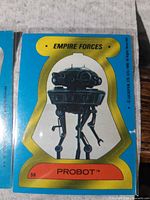 Sticker #58 Probot with blue border and gold bell-shaped frame