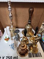 Group shot of eight bells showing sizes and materials