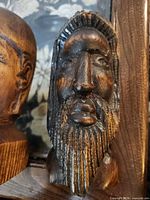 Front view of dark-stained bearded bust