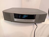 Front view showing display, speaker grilles and CD slot