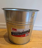 Front view of galvanized steel pail with label visible