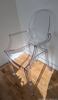 full view of transparent acrylic chair front left