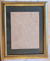 Front view of the gold frame showing mat and overall condition