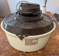 Perspective view of vaporizer humidifier showing basin and lid