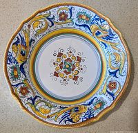 Front of ornate hand-painted ceramic plate