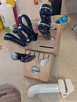 Knife block with knives, shears and sharpener inserted