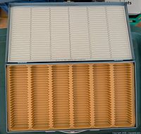 Open slide box showing interior trays and index card