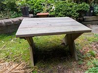 Full view of cedar side table front facing in garden setting