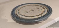 Top view of assembled soap dish showing glaze and drainage holes