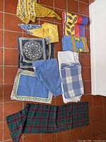 All folded linens overview on tile floor