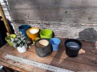 All eight planters arranged on table for size comparison