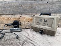 Sander and closed Craftsman case