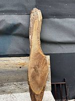 Front view of entire pine slab showing live bark edges and sanded face