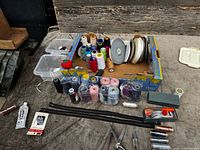 Lot overview showing box of threads, tools and accessories