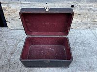 Box open showing burgundy lined interior