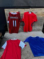 Overview showing four jerseys laid out