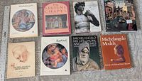 Front covers of eight large art books