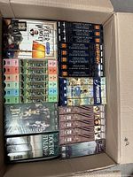 Top view of box showing A Year in Provence, A History of Britain set, Springhill volumes, Doctor Finlay, Tom Jones and other titles