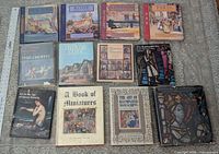 All 12 books laid out in three rows