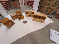 Overall view showing five wooden storage boxes and round dish