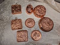 Group shot of all nine copper-tone molds