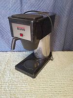 Front and side view of Bunn coffee maker, carafe area visible