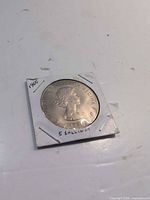 Obverse showing Queen Elizabeth II portrait and date, coin in holder
