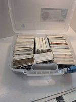 Plastic storage case open showing rows of baseball cards