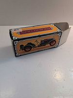 Box exterior showing vintage car illustration