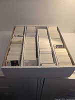 Top view of three-row box densely filled with hockey cards