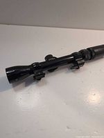 Side view of Bushnell 3-9x32 scope with rings attached
