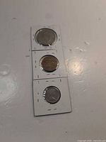 Fronts of three coins in individual 2×2 flips
