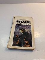 Front cover showing title, author and illustration with visible wear
