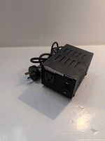 Front view showing output socket, on/off switch and Type B input plug