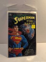 Front cover of bagged Superman for Earth comic