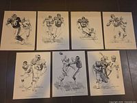 All seven lithograph prints laid out showing full images and condition