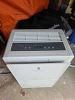 Top and front of Friedrich dehumidifier showing control panel and overall condition