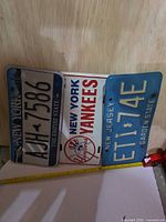 Front view of three license plates side by side